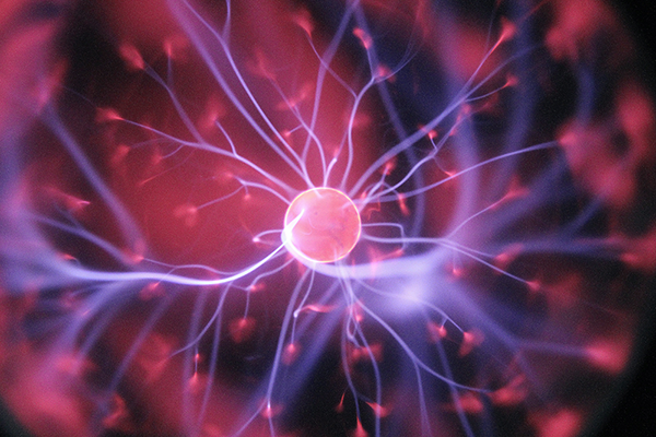 pink and purple plasma ball shooting off sparks of energy